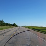 Open road in Minnesota farm area, about 30 miles east of South Dakota