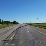 Open road in Minnesota farm area, about 30 miles east of South Dakota